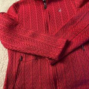 Bright pink cable jacket. Marked women’s large but runs small.
